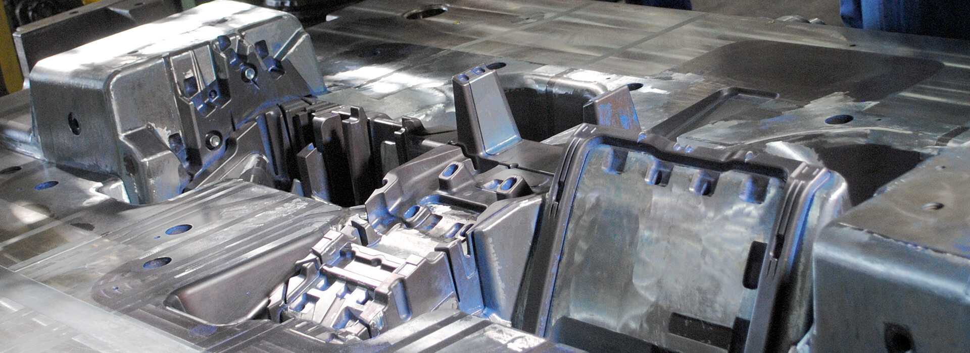 Picture of an ejector half of a high pressure die cast mould of a substrate instrument panel casting