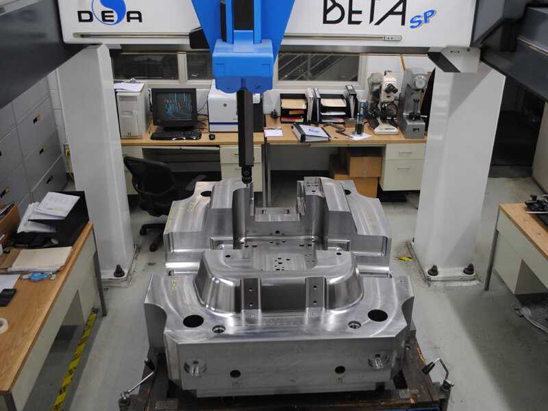 A large CMM measuring a completely finished mould base for a high pressure die cast mould